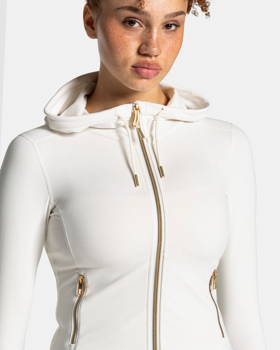 Veste de sport zippée sculptante à capuche Allrounder « blanc cassé / dorée »