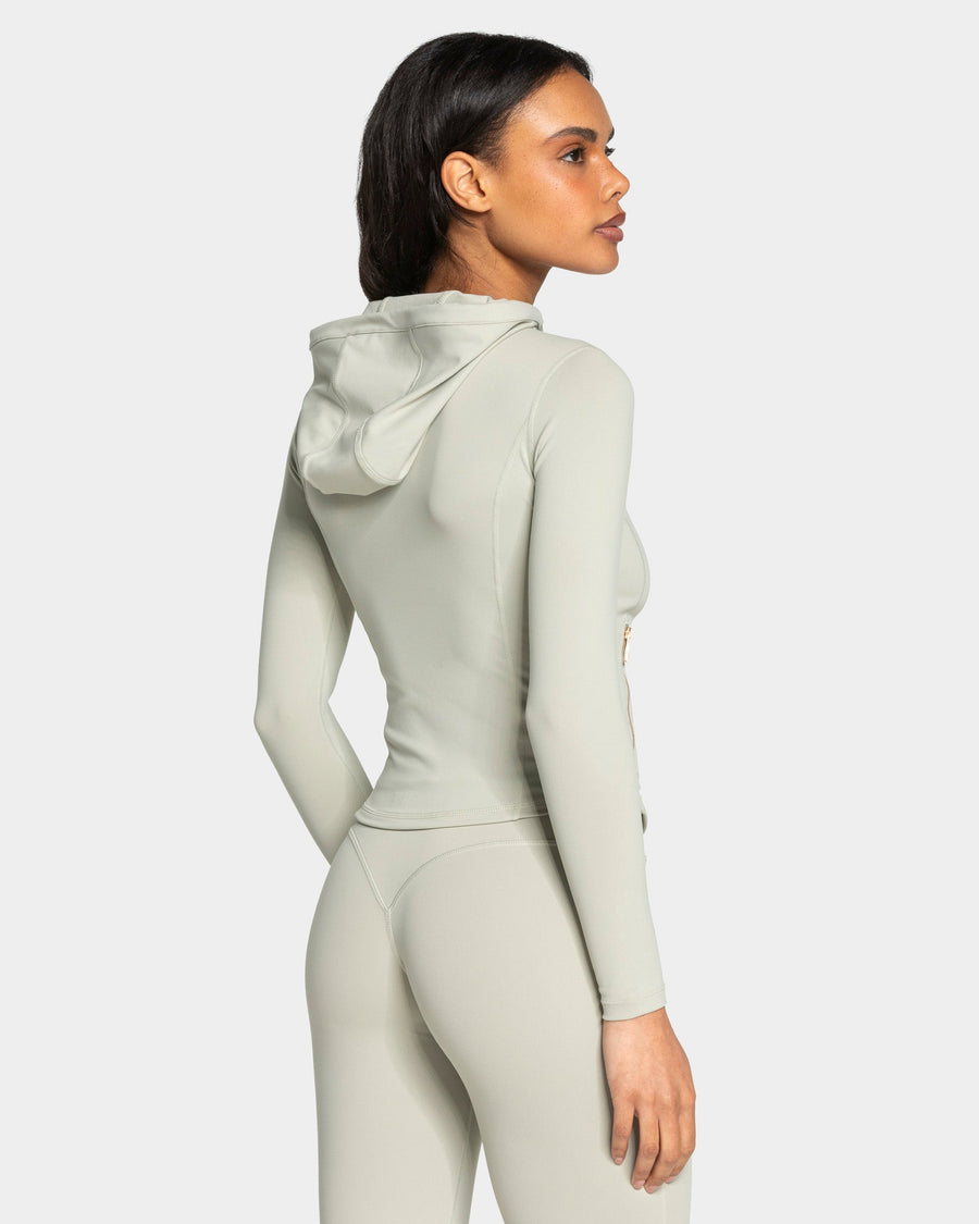 Veste de sport zippée sculptante à capuche Allrounder « pistache/dorée »